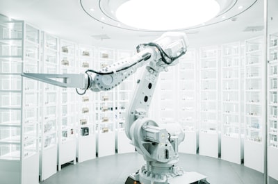 white robotic arm in display showroom