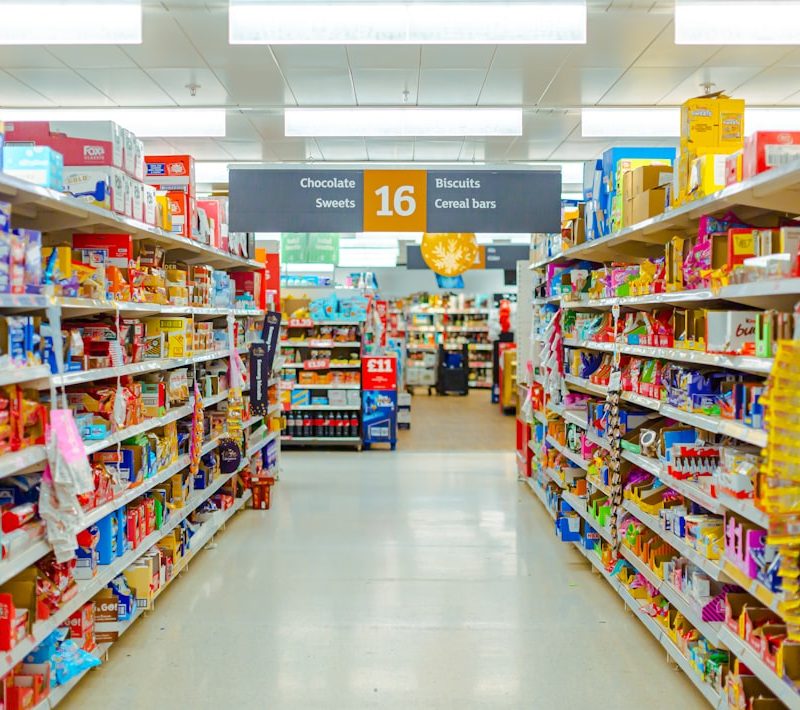 a grocery store aisle filled with lots of food